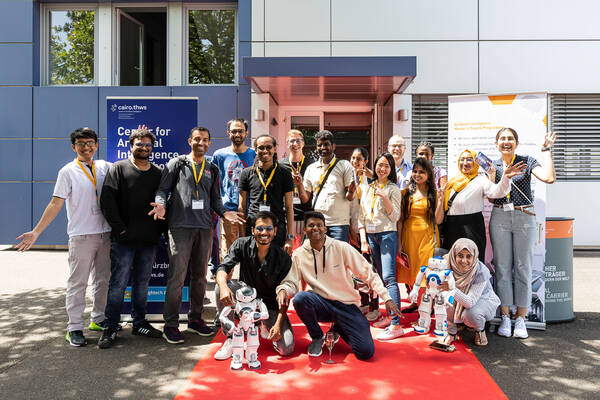 The first MAI students with NAO robots in front of the CAIRO building. (Photo: Stefan Bauswein)